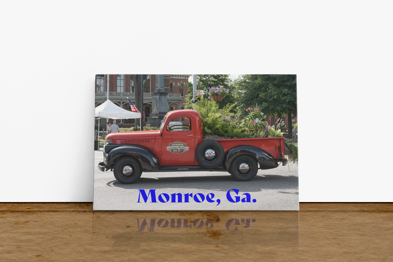 The nostalgic red truck was featured at the Monroe flower show. The truck bed is full of flowers. The retro red pickup truck with black tires and silver hubcaps. The wall art is suitable for a game room or an entry hallway as a conversation piece. It will even fit well in a home study. Printed as a 24x36 inch image on polycotton canvas and hand-stretched into canvas wrap. Pine stretcher bars are used for the wrap. Each wrap is made to order and printed on our HP Latex printers.