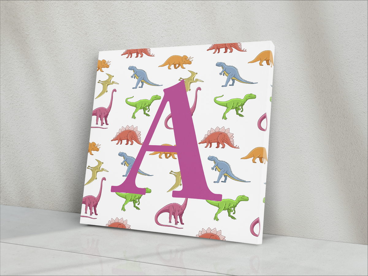 ABOUT:  Alphabet Letter A 8"x8" Square Dinosaurs in Background Blue or Pink Letter Canvas Wrap  Made to Order  CANVAS WRAP DETAILS  Mirrored image on four sides. Digital file used in the print process Canvas is cotton-poly has a white base with a satin finish. Image printed with latex ink. Canvas is hand-stretched on notched 1.5-inch wood stretcher bars. The wrap is secured to the stretcher bars using staples. The back is covered with brown kraft paper, glued, and taped in place.