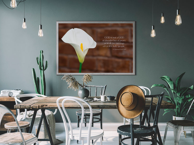 An image of white lily w/ inspirational text printed on 20x24 inch canvas wrapped on artist&#39;s stretcher bars. The cotton-poly canvas has a semi-gloss finish and is hand-stretched and stapled in place. Kraft paper covers the back of the frame.