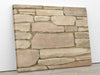 An image of stacked stone mosaic printed on 20x24 inch canvas wrapped on artist&#39;s stretcher bars. The cotton-poly canvas has a semi-gloss finish and is hand-stretched and stapled in place. Kraft paper covers the back of the frame.